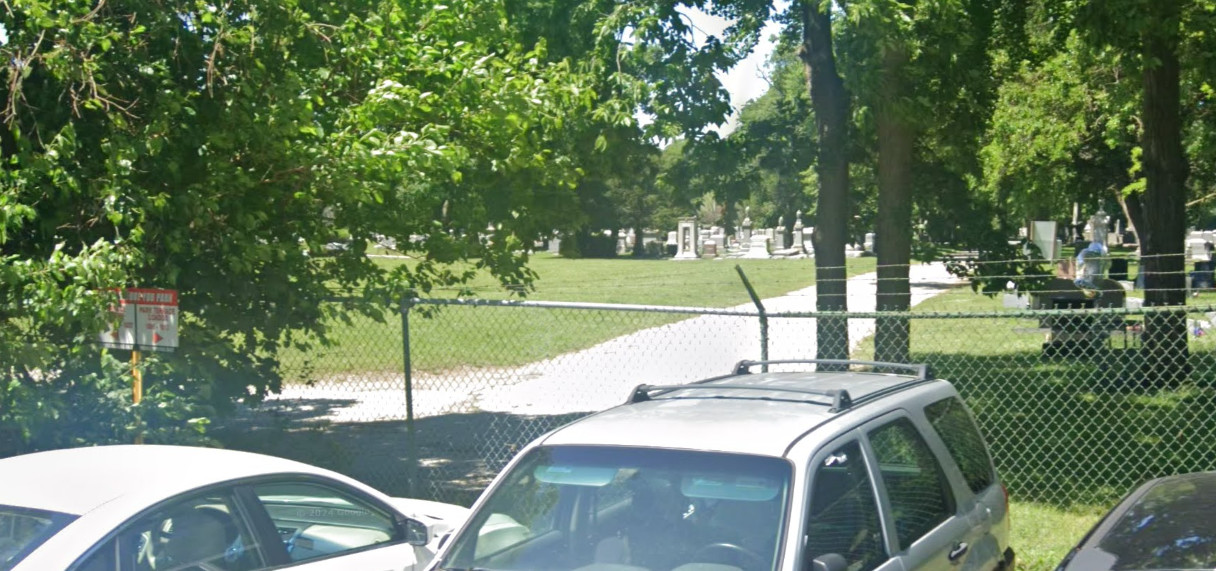 Barbed Wire Fence in Parking Lot